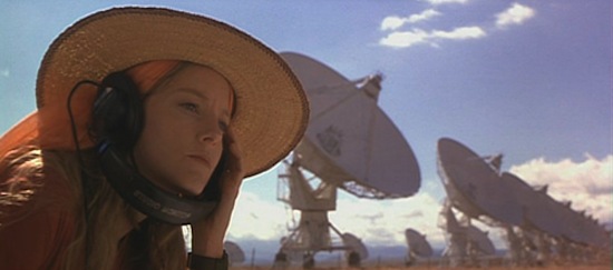 A hopeful Dr Ellie Arroway (Jodi Foster) listens for ET in the film adaption of the novel 'Contact'.  Copyright Warner Bros.  1997